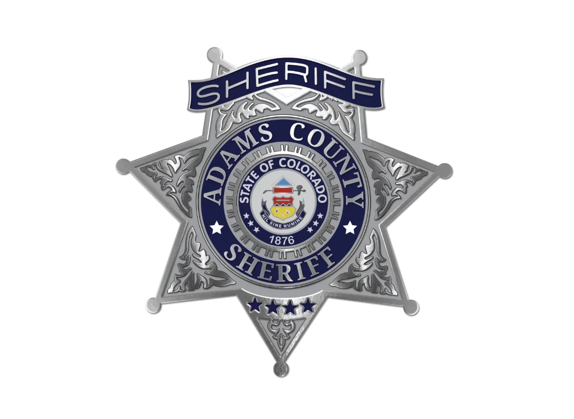 Adams County Sheriff badge featuring the State of Colorado seal and "1876" text